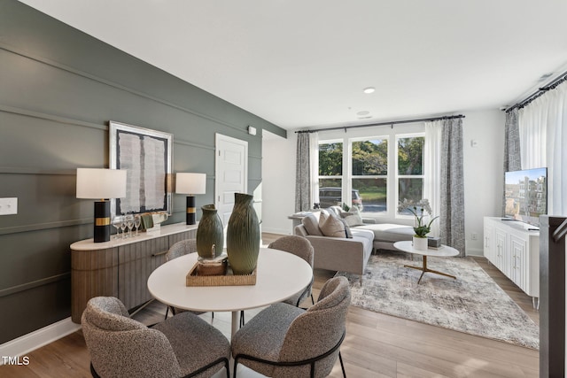 dining space featuring hardwood / wood-style floors