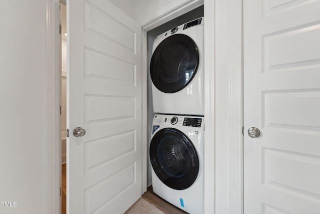 laundry room featuring stacked washer and clothes dryer