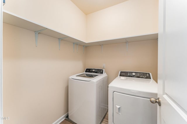 laundry room with independent washer and dryer