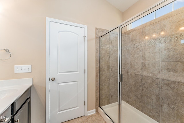 bathroom featuring vanity and a shower with shower door