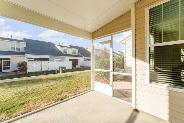 unfurnished sunroom with vaulted ceiling