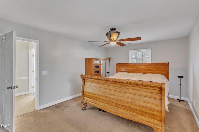 bedroom with ceiling fan and carpet flooring