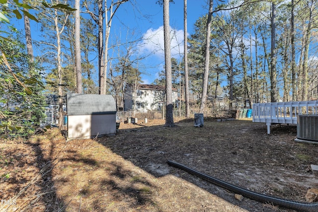 view of yard with a shed and cooling unit