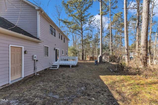 view of yard featuring a wooden deck