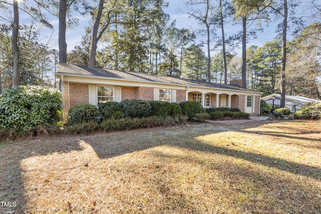 ranch-style house with a front lawn