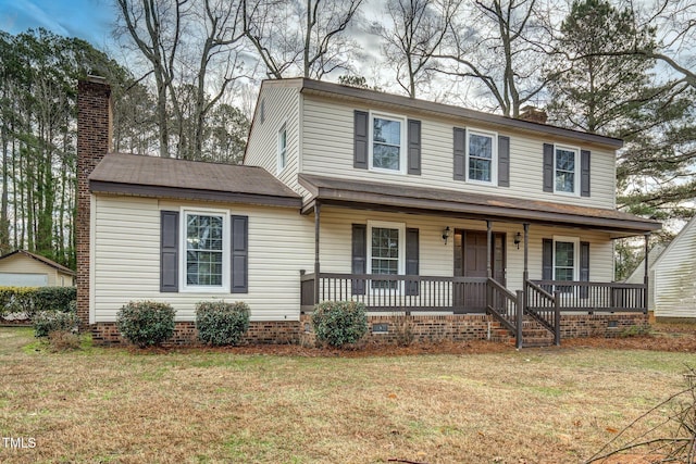 view of front facade with covered porch and a front lawn