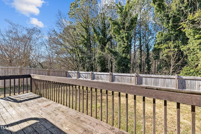 wooden terrace with a yard