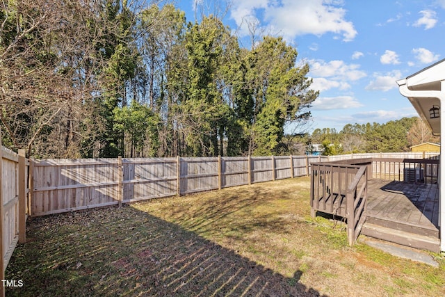 view of yard featuring a wooden deck