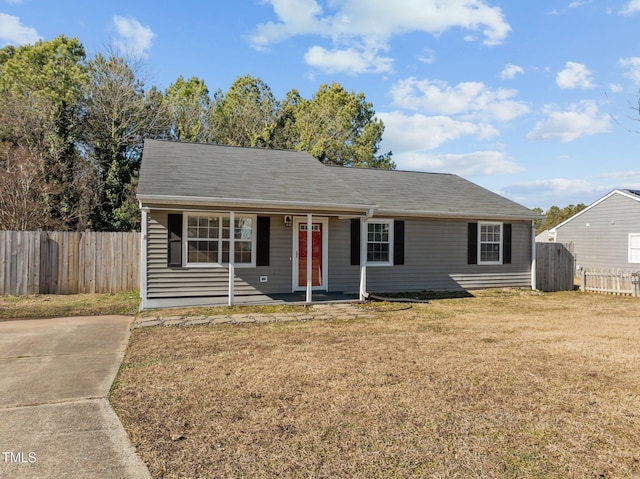 ranch-style home featuring a front yard