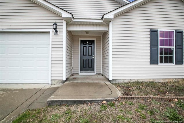 entrance to property featuring a garage