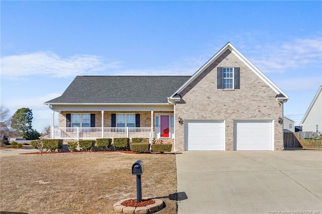 view of front facade with a front yard, a garage, and covered porch