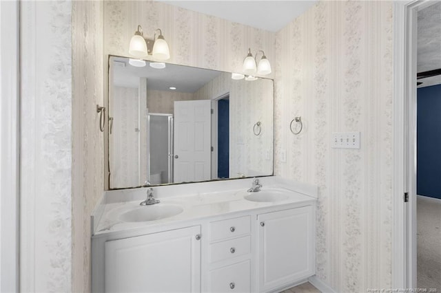 bathroom with an enclosed shower and vanity