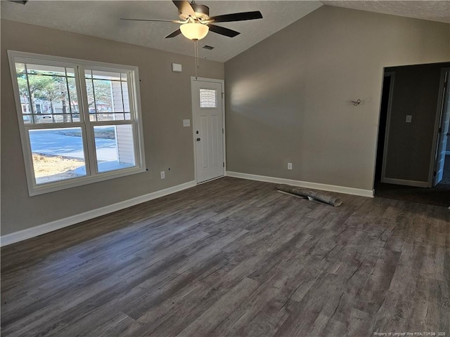 foyer with dark wood-style flooring, visible vents, a ceiling fan, vaulted ceiling, and baseboards