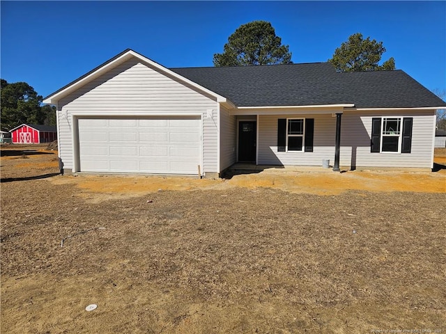 ranch-style house featuring a garage