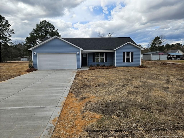 ranch-style house featuring an attached garage and driveway