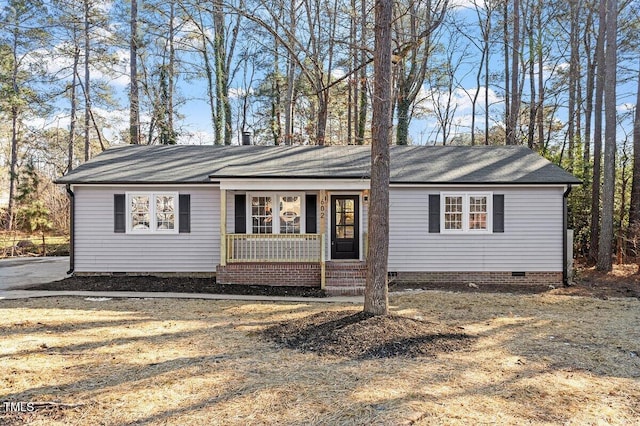 ranch-style house with a front lawn and a porch