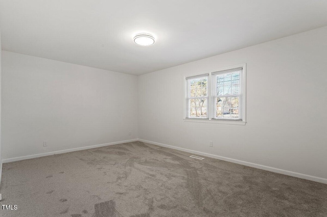 spare room with carpet floors