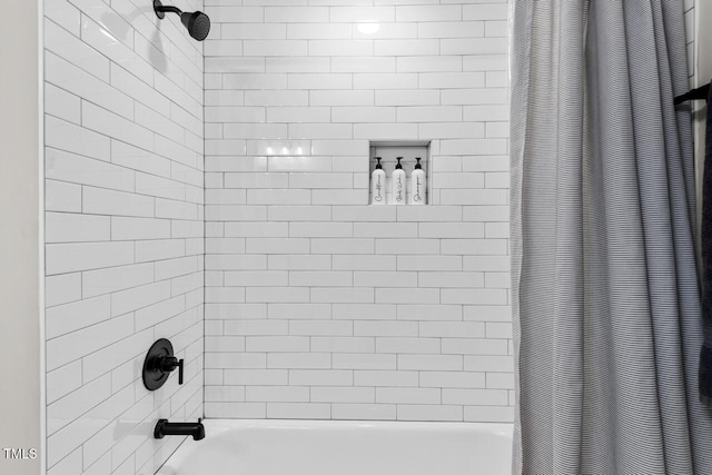 bathroom with shower / tub combo with curtain