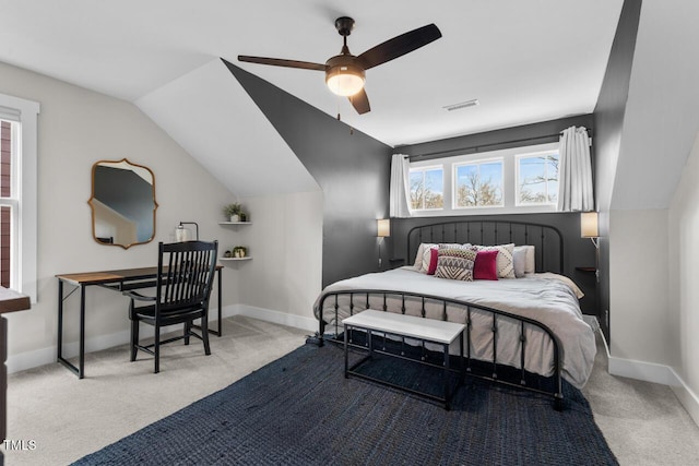 bedroom with lofted ceiling, light colored carpet, and ceiling fan