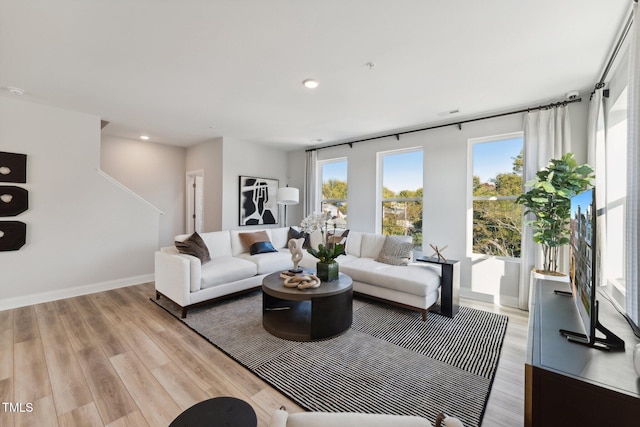 living room with light hardwood / wood-style floors