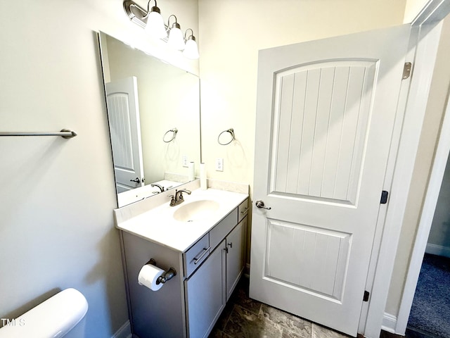 bathroom with toilet and vanity