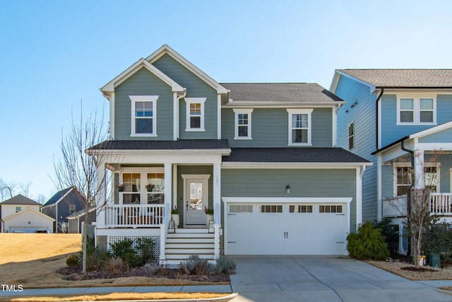 craftsman inspired home featuring a garage and covered porch