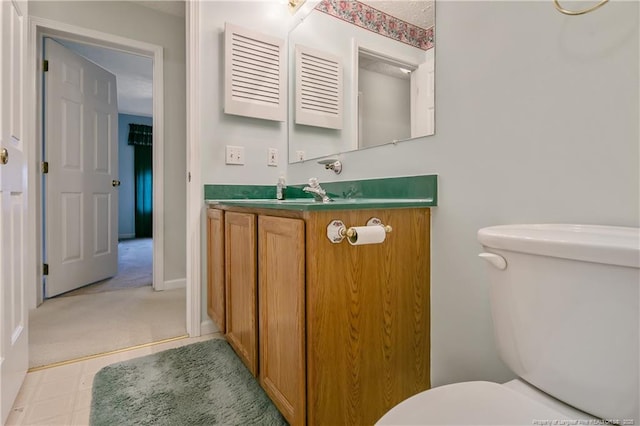 bathroom with toilet and vanity