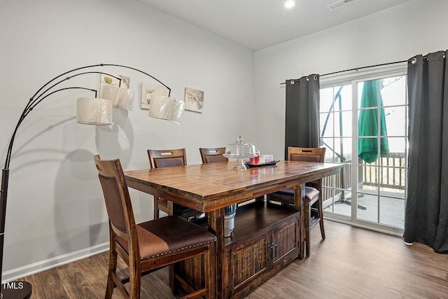 dining area featuring hardwood / wood-style flooring