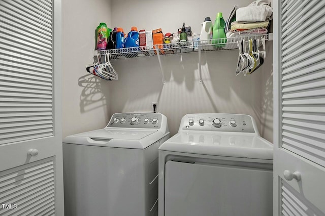 washroom with washing machine and dryer