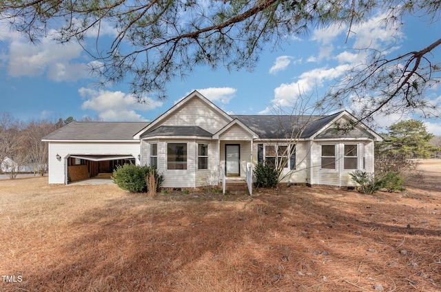 ranch-style house with a front yard and a garage