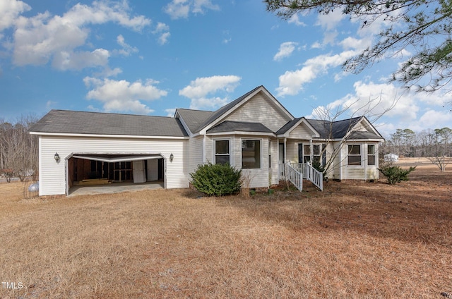 single story home featuring a front lawn and a garage