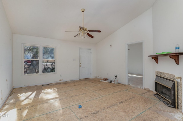 unfurnished living room with vaulted ceiling, ceiling fan, heating unit, and a fireplace