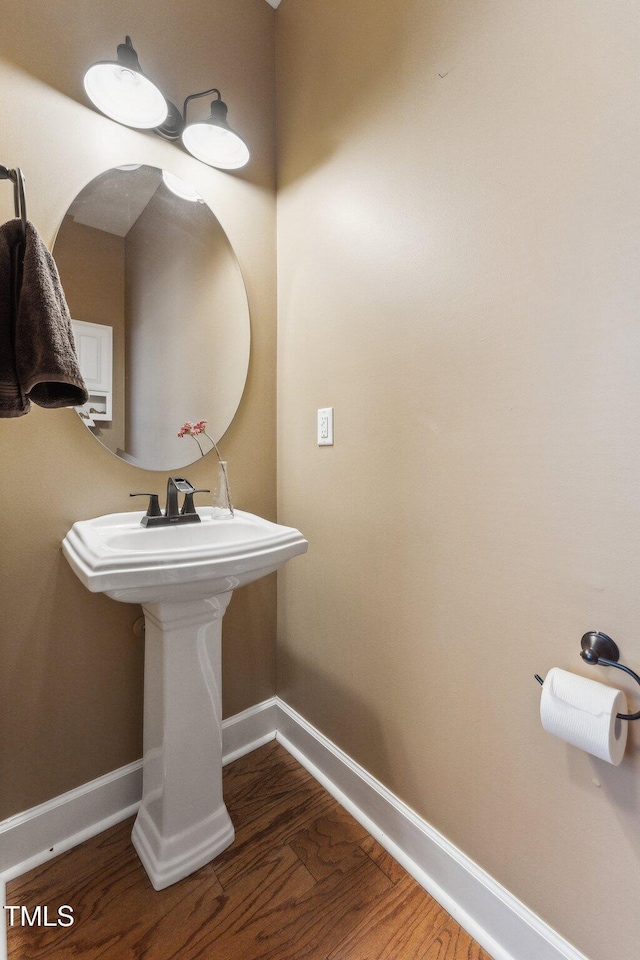 bathroom with hardwood / wood-style flooring