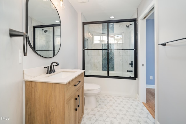 full bathroom with toilet, vanity, and shower / bath combination with glass door