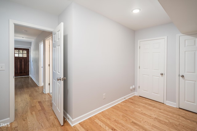 hall with light hardwood / wood-style flooring