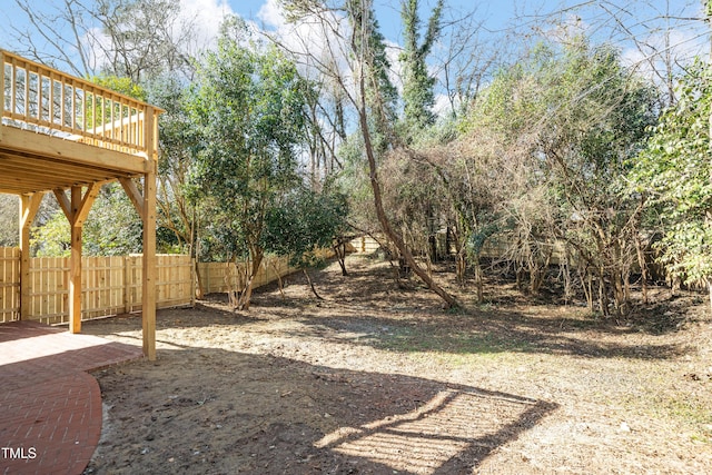 view of yard featuring a wooden deck