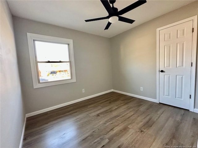 unfurnished room featuring ceiling fan and wood-type flooring