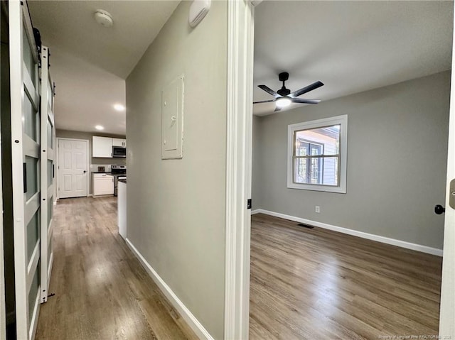 hall with light hardwood / wood-style flooring