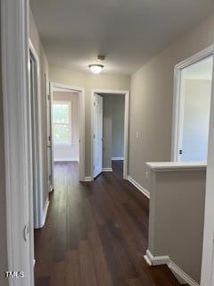 hall with dark hardwood / wood-style floors