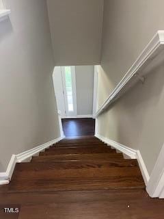 stairs with hardwood / wood-style floors