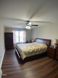 bedroom with dark wood finished floors, a ceiling fan, and baseboards