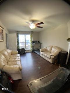 living room with wood finished floors and a ceiling fan