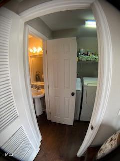 interior space with wood finished floors and washer and clothes dryer