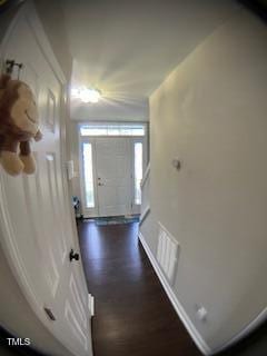 entryway featuring baseboards, visible vents, and dark wood-style flooring