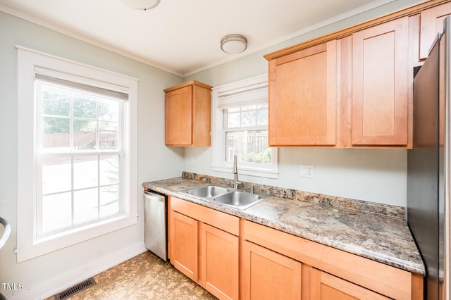 kitchen with light brown cabinetry, sink, dishwasher, and ornamental molding