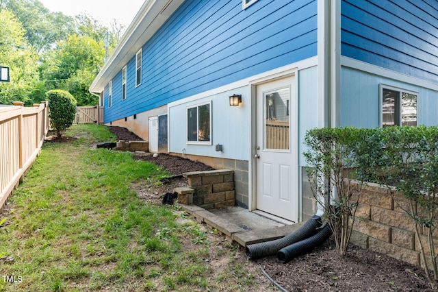 view of home's exterior with a yard