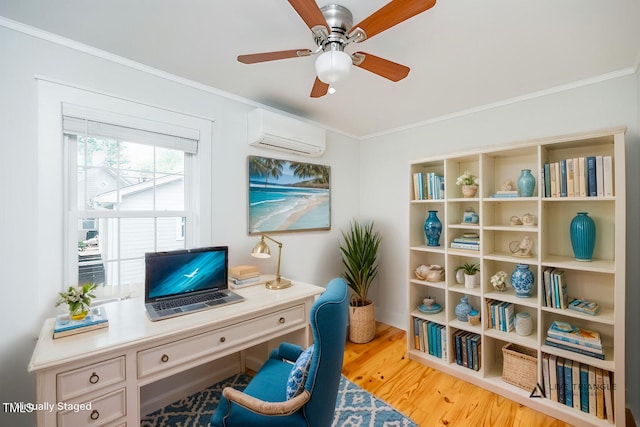 office area with ceiling fan, a wall mounted AC, light hardwood / wood-style flooring, and crown molding