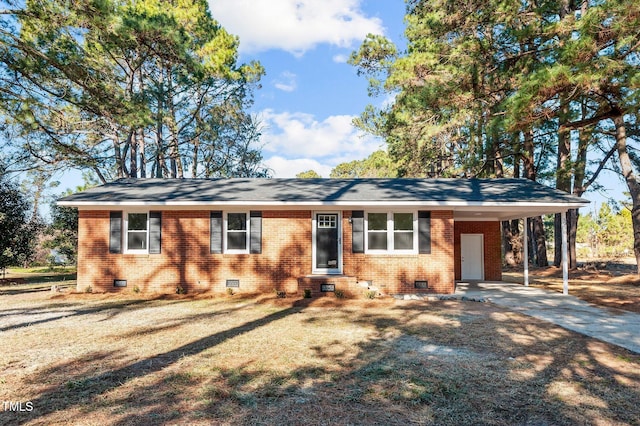 ranch-style home with a carport