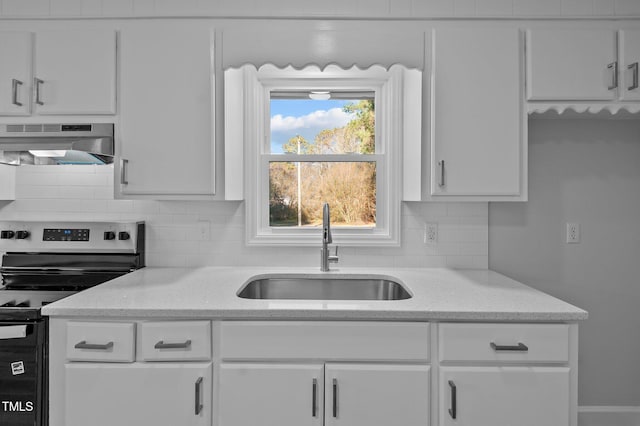 kitchen with exhaust hood, white cabinetry, electric stove, sink, and light stone counters