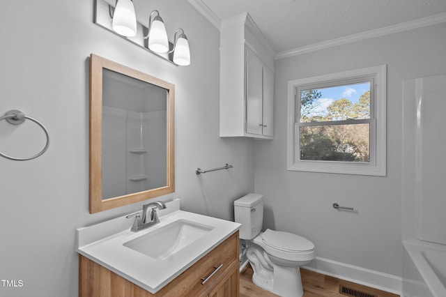 bathroom with hardwood / wood-style flooring, a textured ceiling, toilet, and vanity